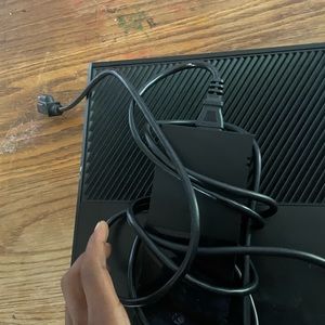 Xbox one black unused with a controller